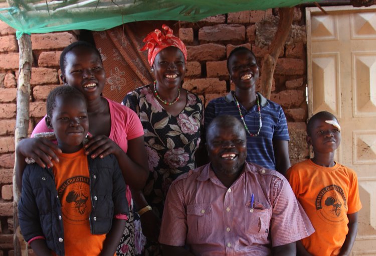 Cabina (rear center) and her family
