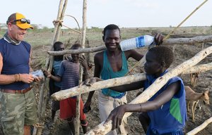 Receiving audio Bibles while they fetch wood-3.jpg
