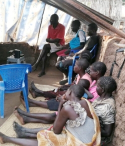 Pastor Paul (in red) showing The JESUS Film