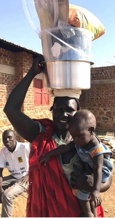 A Nuba mother receives help