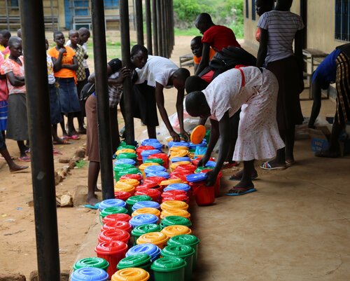 Preparing for a Dignity Kit distribution at a local Christian school.