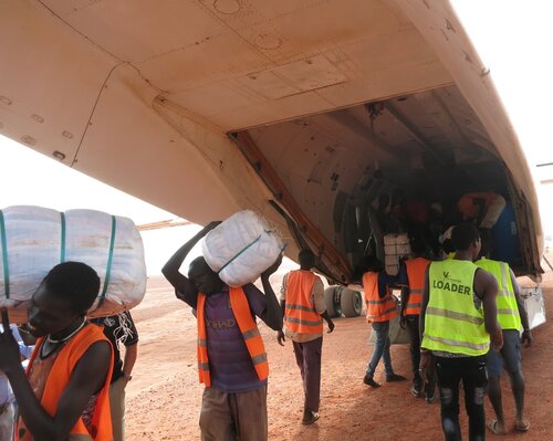 Air charters transport goods to the field.