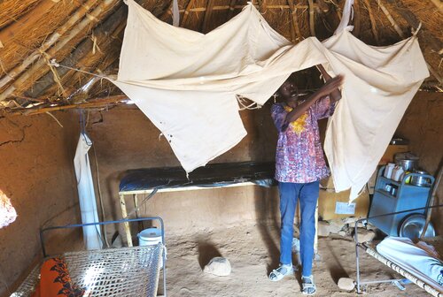 The old maternity ward with the birthing table behind the sheet.