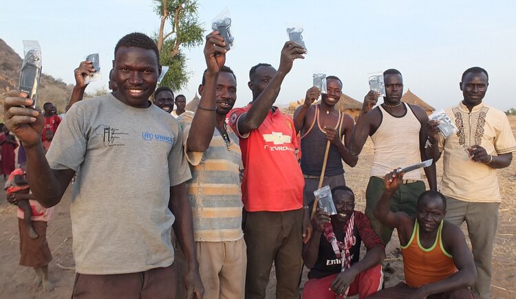 After a hard day’s work wrangling cattle, these men were excited to get an audio Bible.