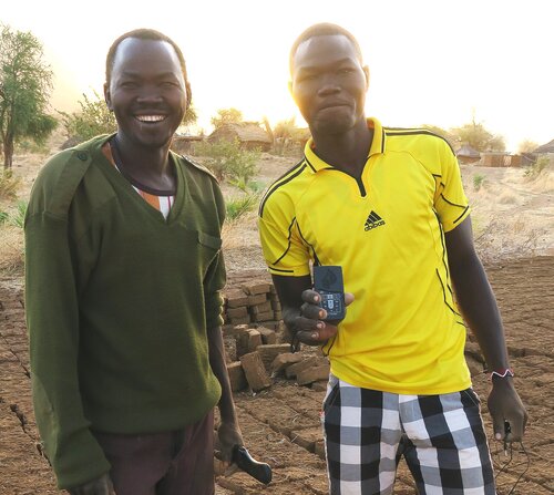Two brick-makers with an audio Bible