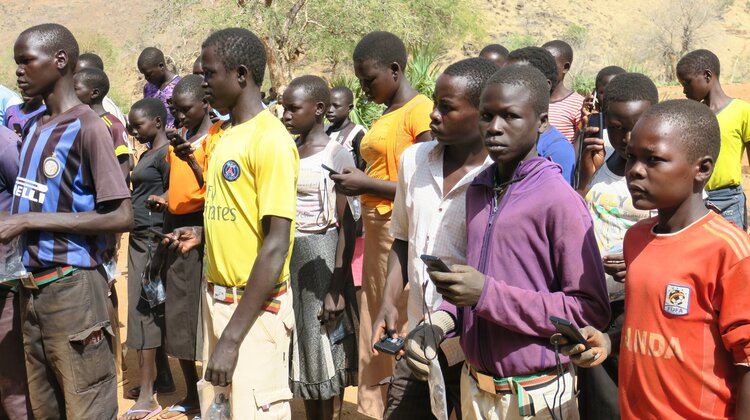Christian school students receive audio Bibles.