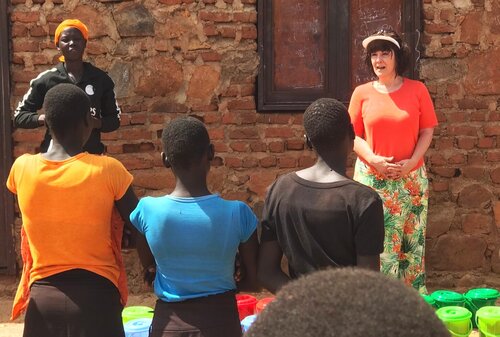 Instructing young girls on using Dignity Kits