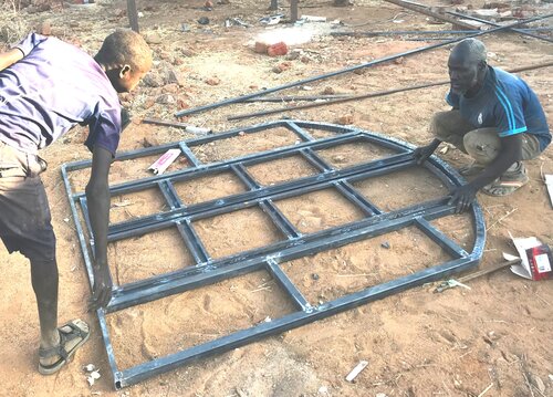 Assembling a door frame for Gigaiba’s Maternity Ward