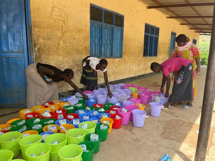 Ladies filling Dignity Kits