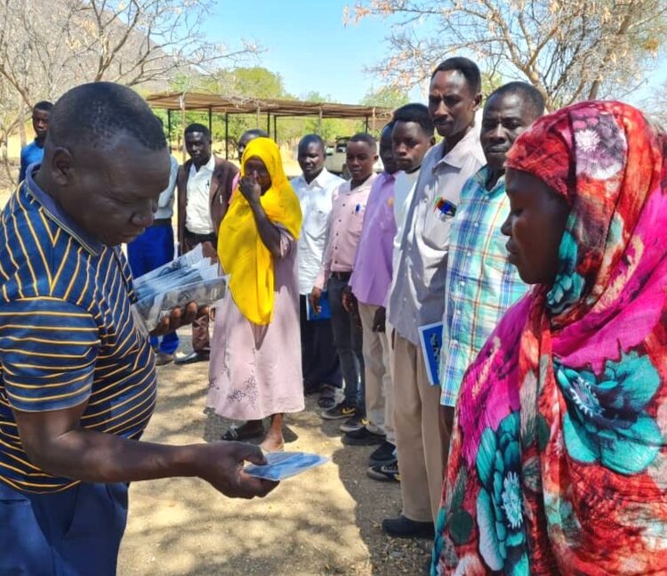 Pastor Matta distributing audio Bibles