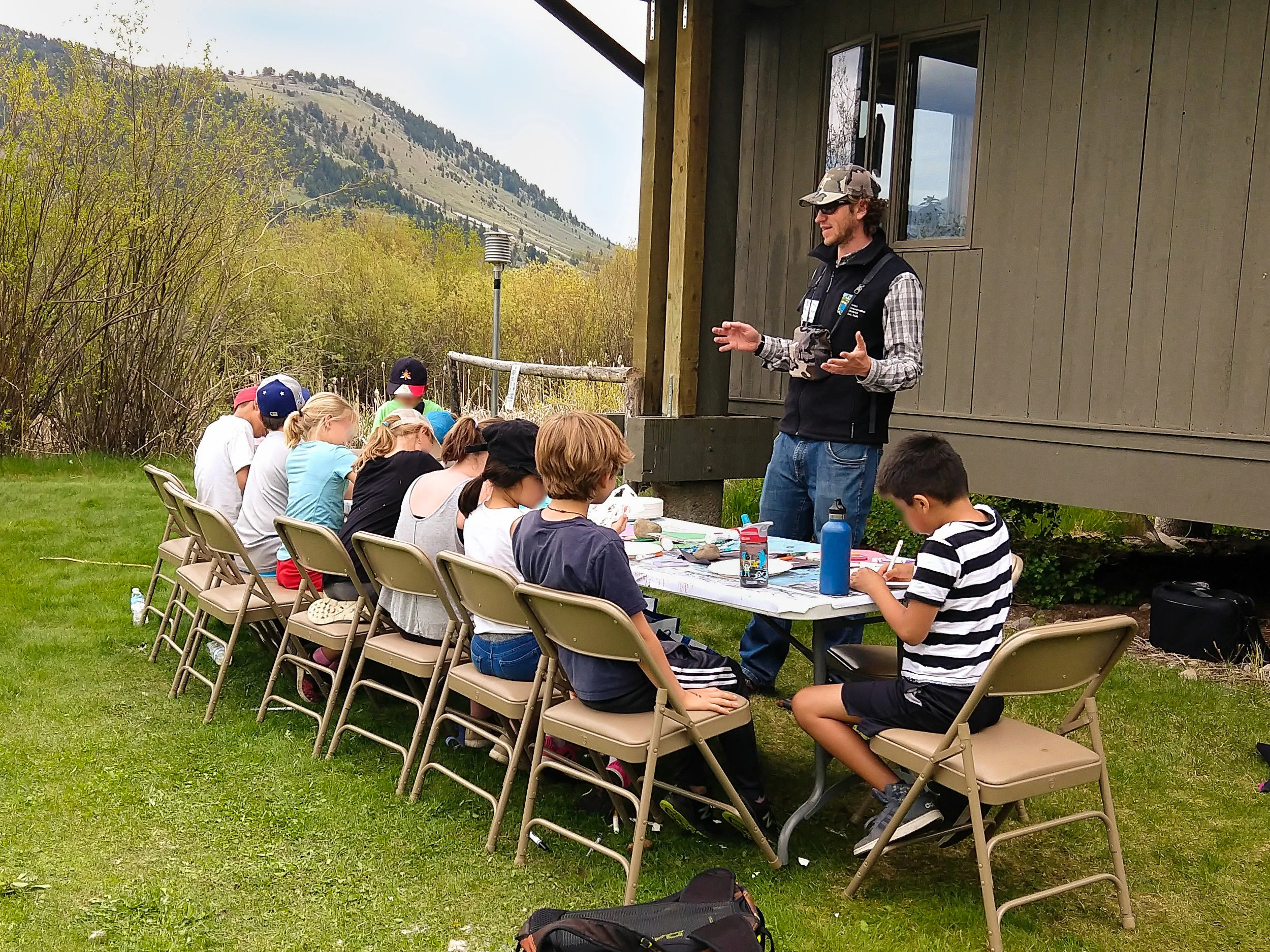 Morgan Graham talks to a group of 4th graders about bird strikes.