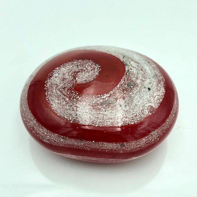 Ruby Glass Skipping Stone infused with cremation ashes. The cremains are visible in the silver spiral in the glass. .
.
.
.

#cremation #cremationashes #cremationkeepsake #cremations  #cremationurn #urn #cremationashes #memorialart #ashesinglass #emb