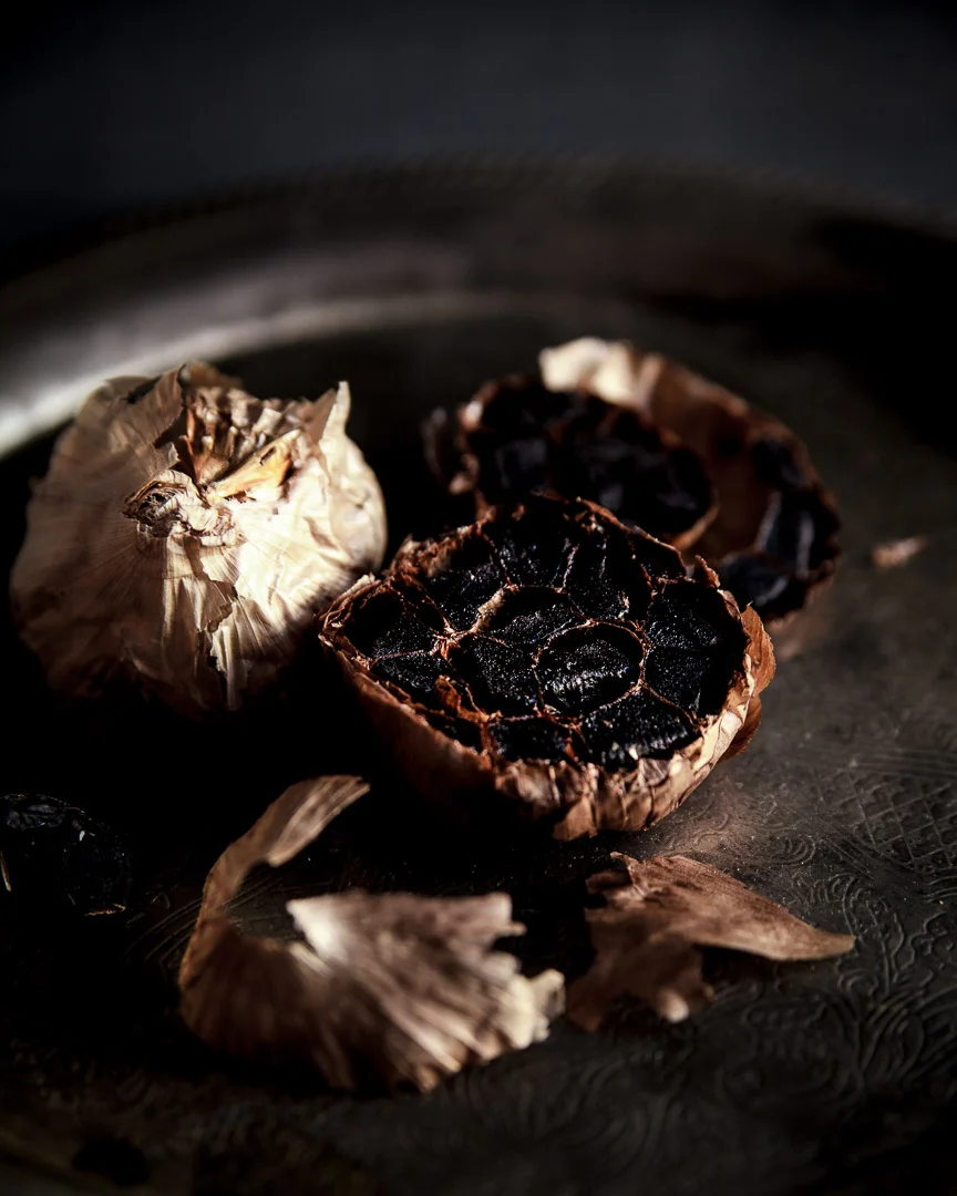 black garlic shot with moody background and light. Sarah Ehlinger / Brand Spanking You Brand Photography