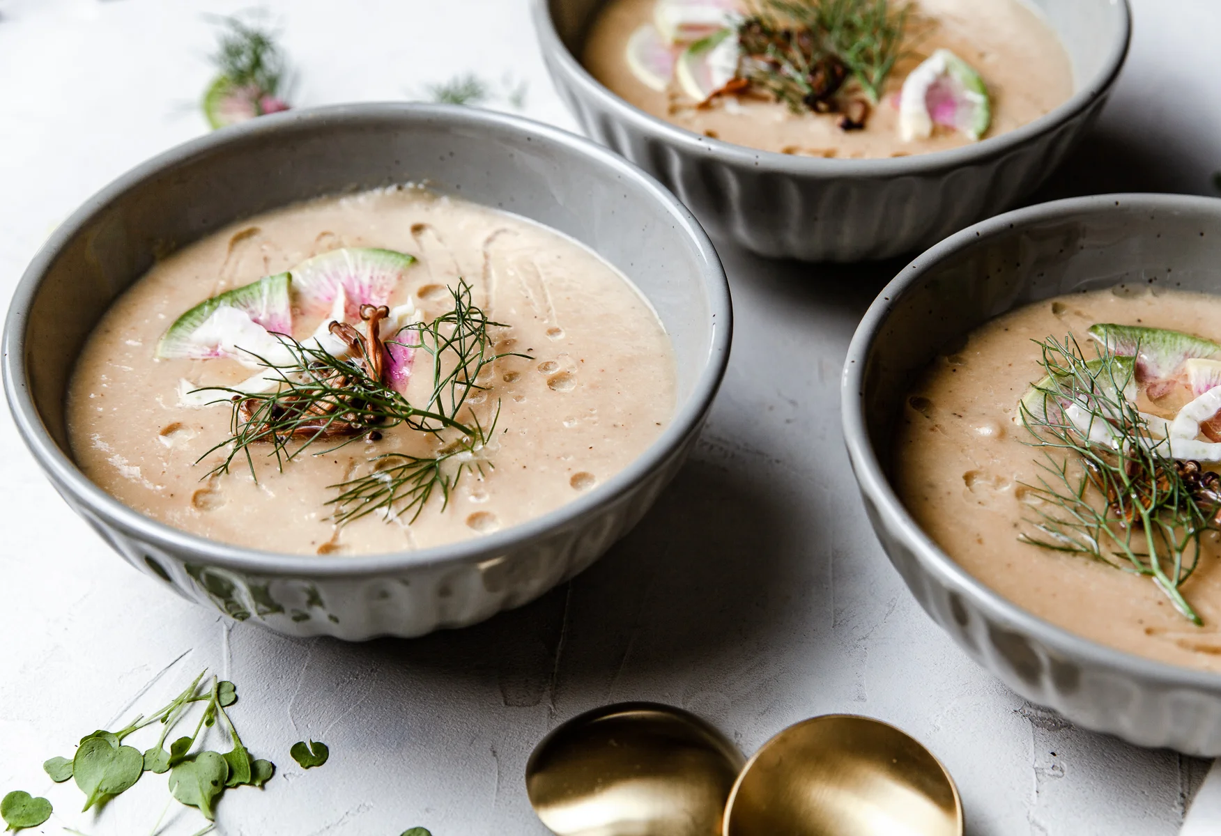 Roasted fennel and celery soup. Topped with micro greens, watermelon radish, fennel tops