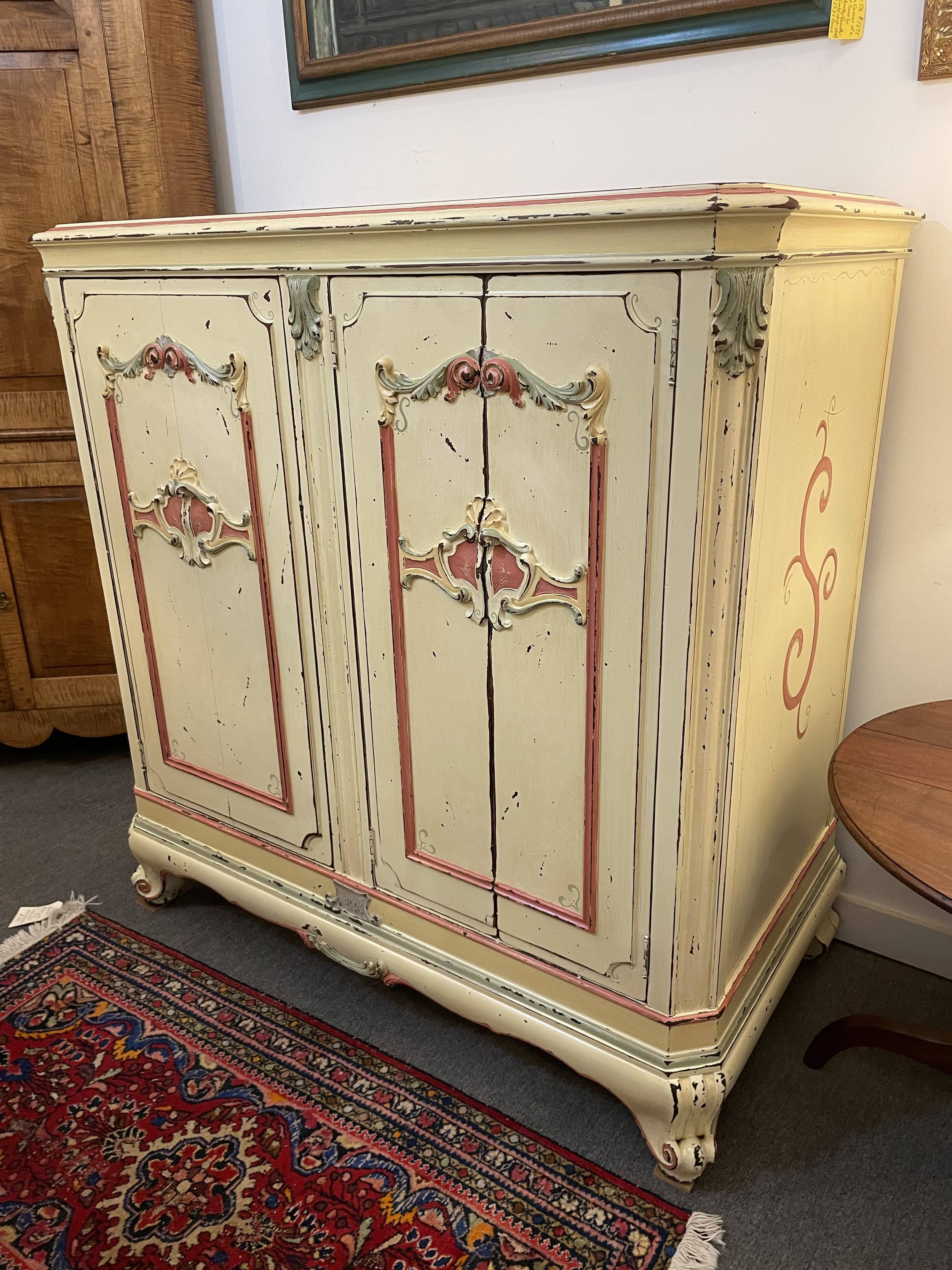  SOLD 2231002  Victor Victrola Cabinet. Circa 1927. Paint job signed by Corie Kline (Ohio}. 3 Doors. Inside converted to all shelves. 48”W x 25”D x 49.5”H. $750 