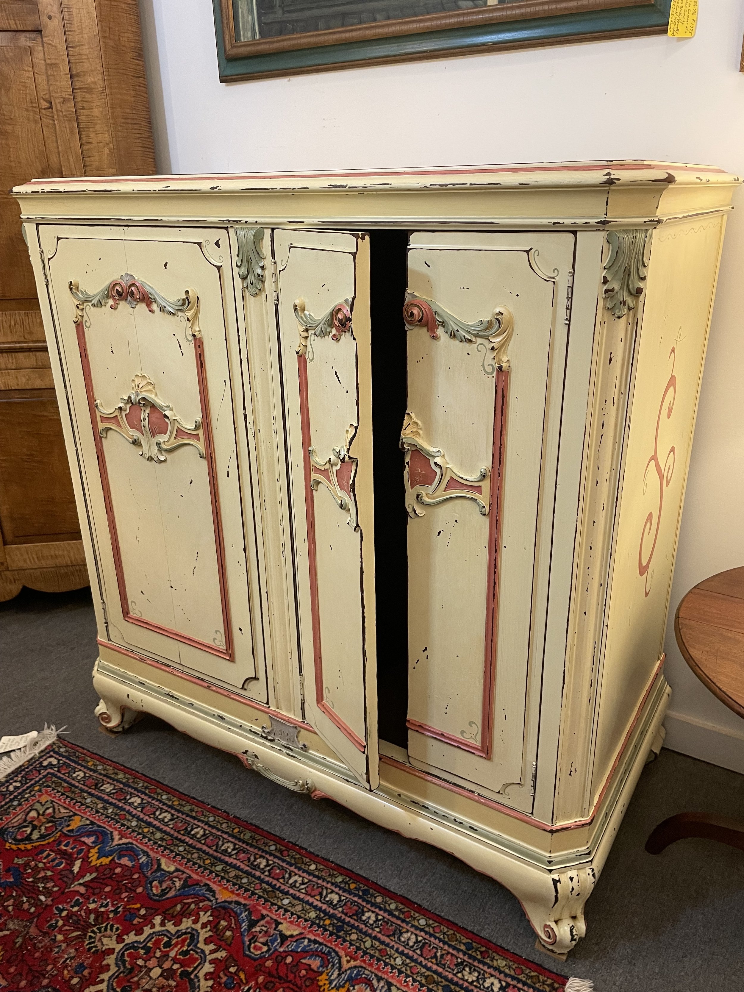  2231002  Victor Victrola Cabinet. Circa 1927. Paint job signed by Corie Kline (Ohio}. 3 Doors. Inside converted to all shelves. 48”W x 25”D x 49.5”H. $750 