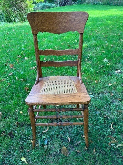  2231049 Set of 8, quarter-sawn oak, side chairs. Seats have been re-caned. Circa 1900. $975 