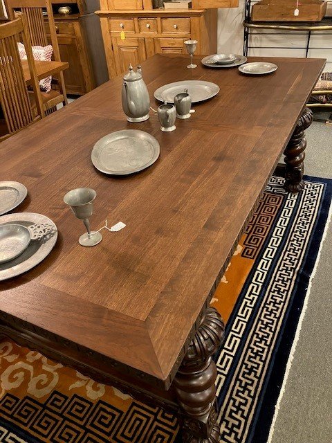  2231077 Exceptional, Walnut, Dining Table. Circa 1900. No veneer. Top is 1  5/8” thick. Skirts at both ends pull out with fold down support legs for large length extensions. Large legs are carved and splayed out. Iron decoration under top. Main top 