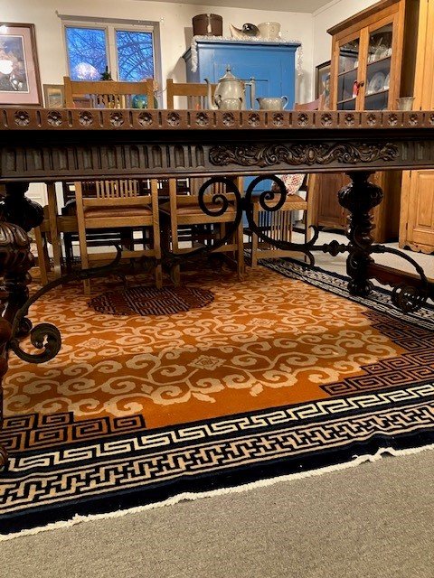  2231077 Exceptional, Walnut, Dining Table. Circa 1900. No veneer. Top is 1  5/8” thick. Skirts at both ends pull out with fold down support legs for large length extensions. Large legs are carved and splayed out. Iron decoration under top. Main top 