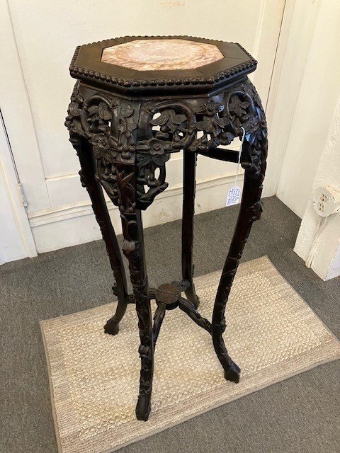  2241012 Lamp Stand. Hand carved teak with octagon top and marble center inset. Cherry branch motif. 1800’s. 16” maximum diameter. 35” H. $485 
