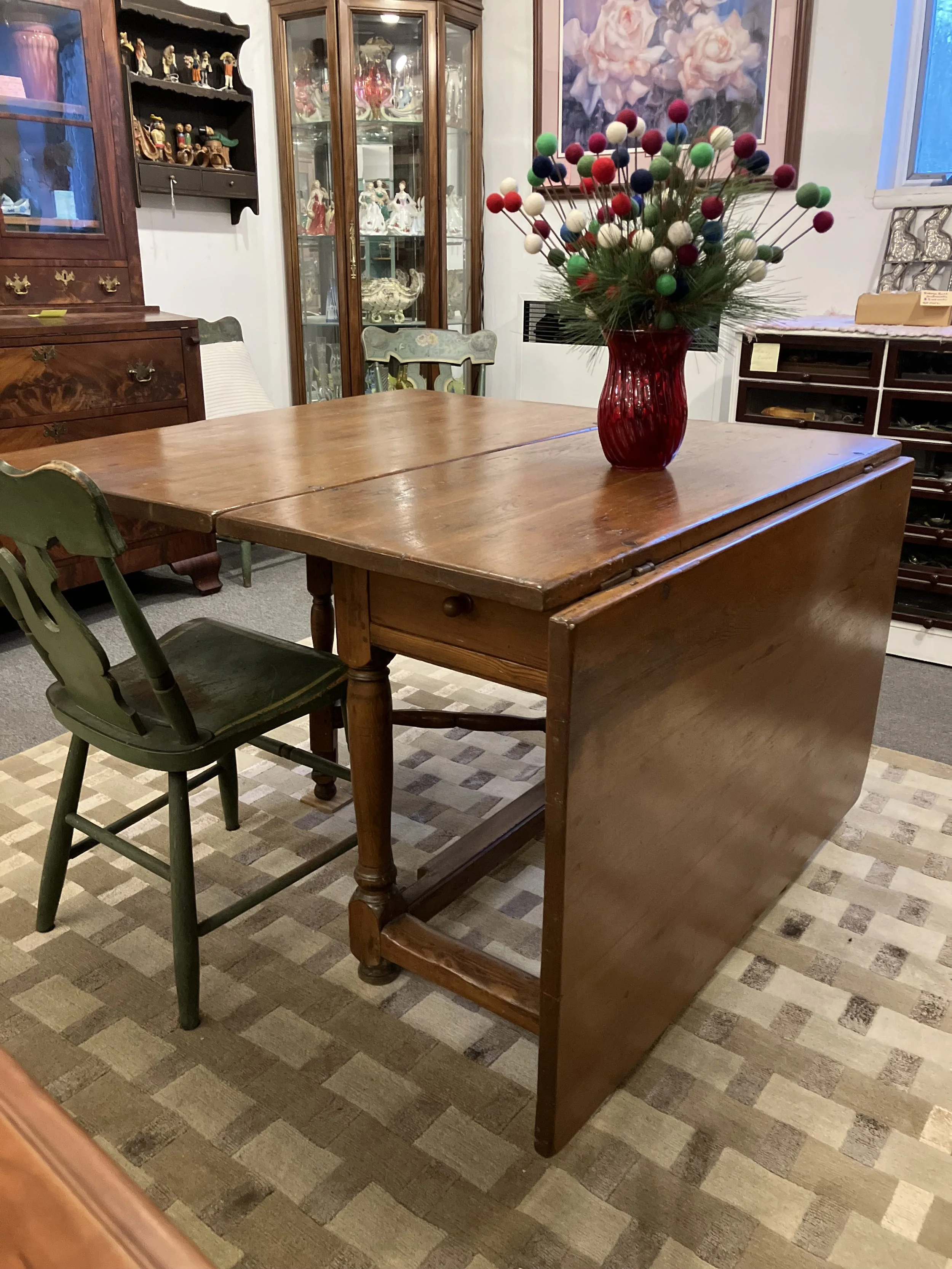 2261001 Early American, Pine, Drop Leaf, Gate Leg Table. Circa 1820. One Drawer. 43.5” W. 20.5” L with both drop leafs down. 70” L with both drop leafs up. 29” H. Seats 6. $1250 
