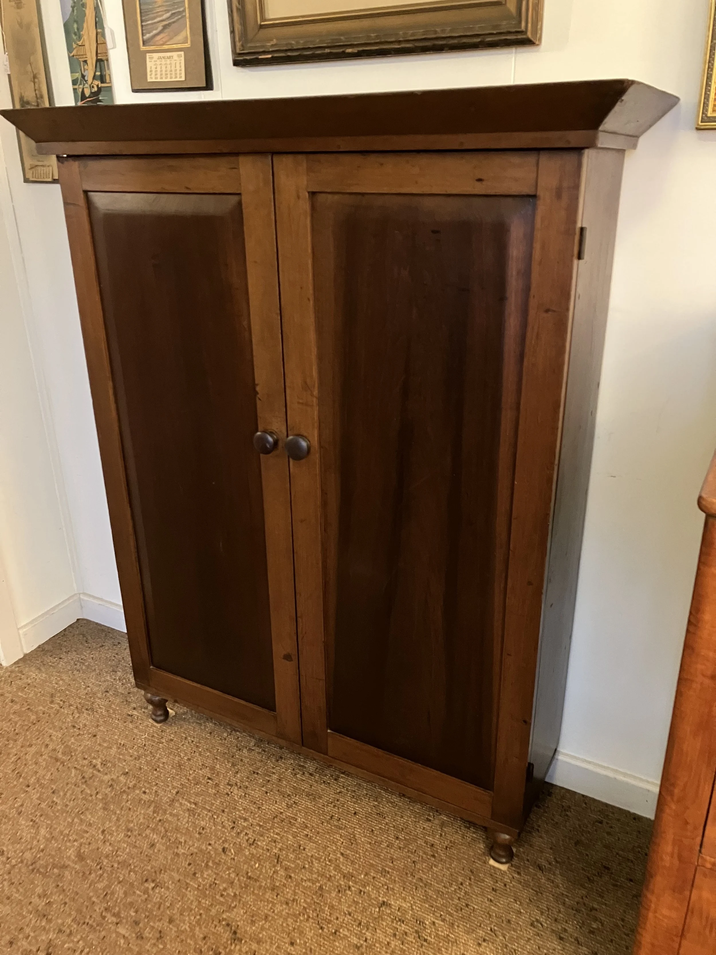  2261007 Walnut Bookcase. 2 Great doors with raised panels. 5 shelf surfaces inside. Feet are old but were added. C. 1860. 44” W x 13.5” D x 55.5” H. $750 