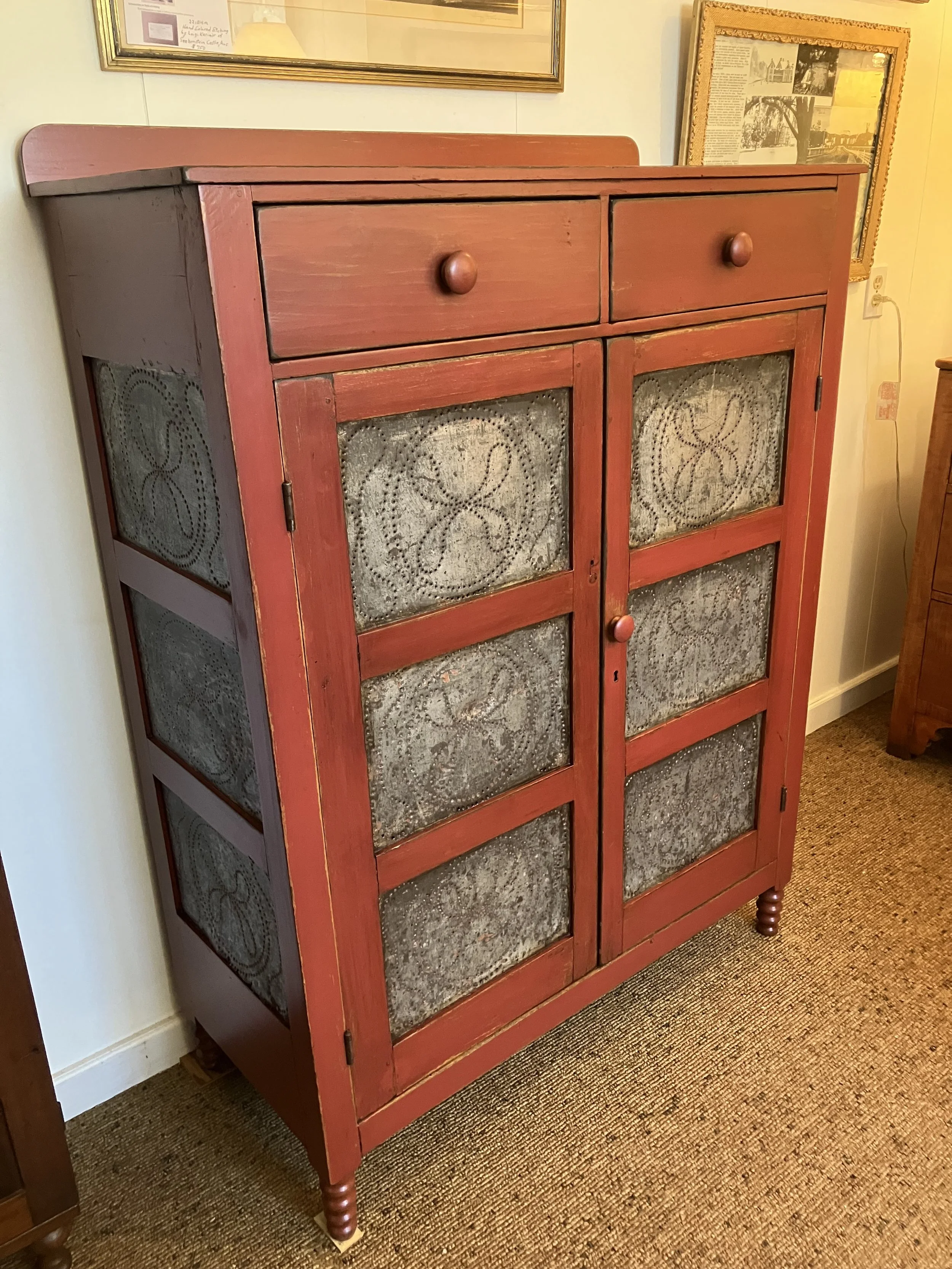  2251037 Pie Safe, with 12 Panels of Pierced Tin. In Red Paint. C. 1860. 41” W x 18” D x 55”H. $1275 