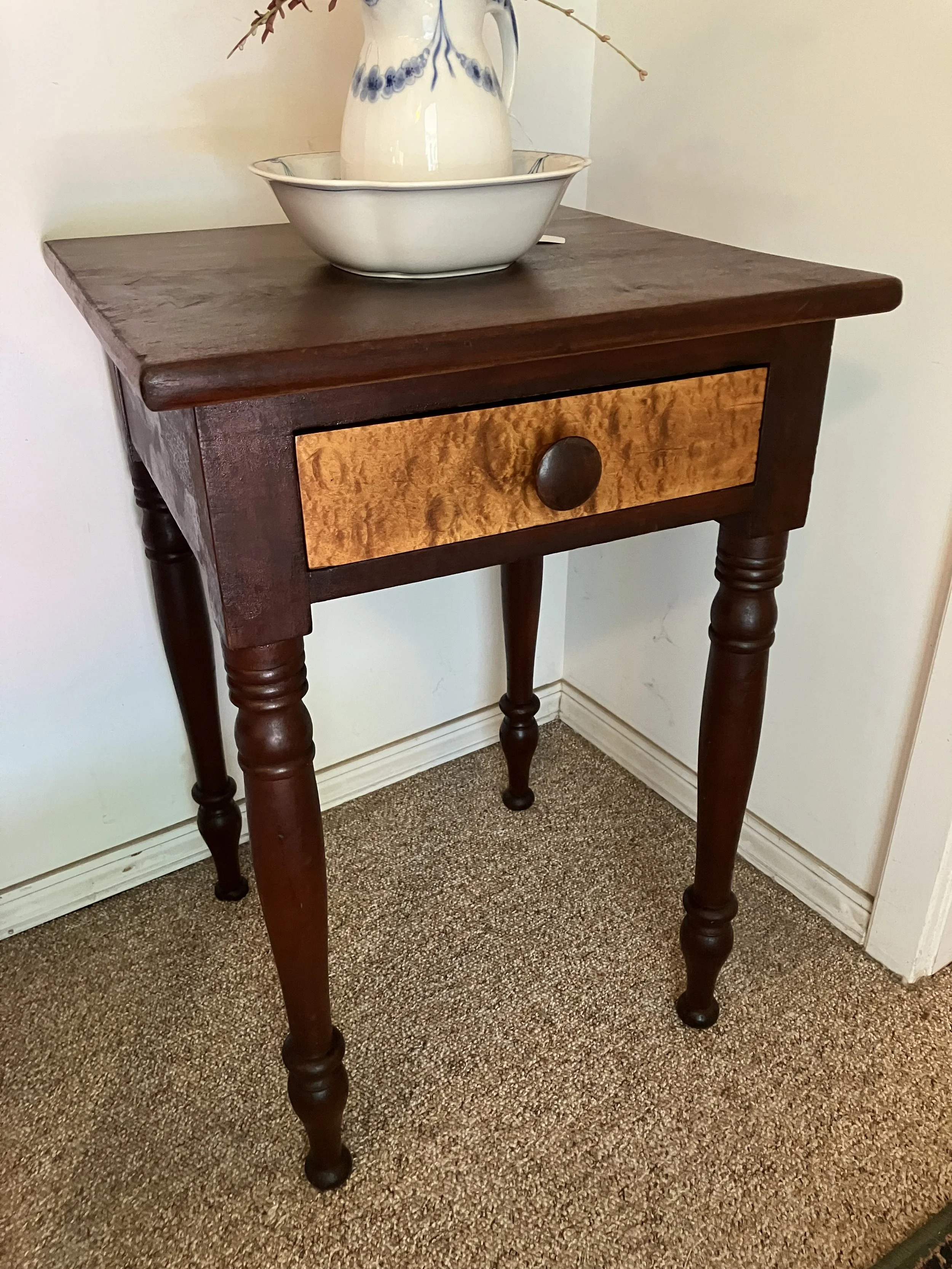  2261003 One Drawer Stand. Cherry with birdseye maple drawer front. Circa 1860. 19.75” W x 19.5” D x 28.75” H. $385 