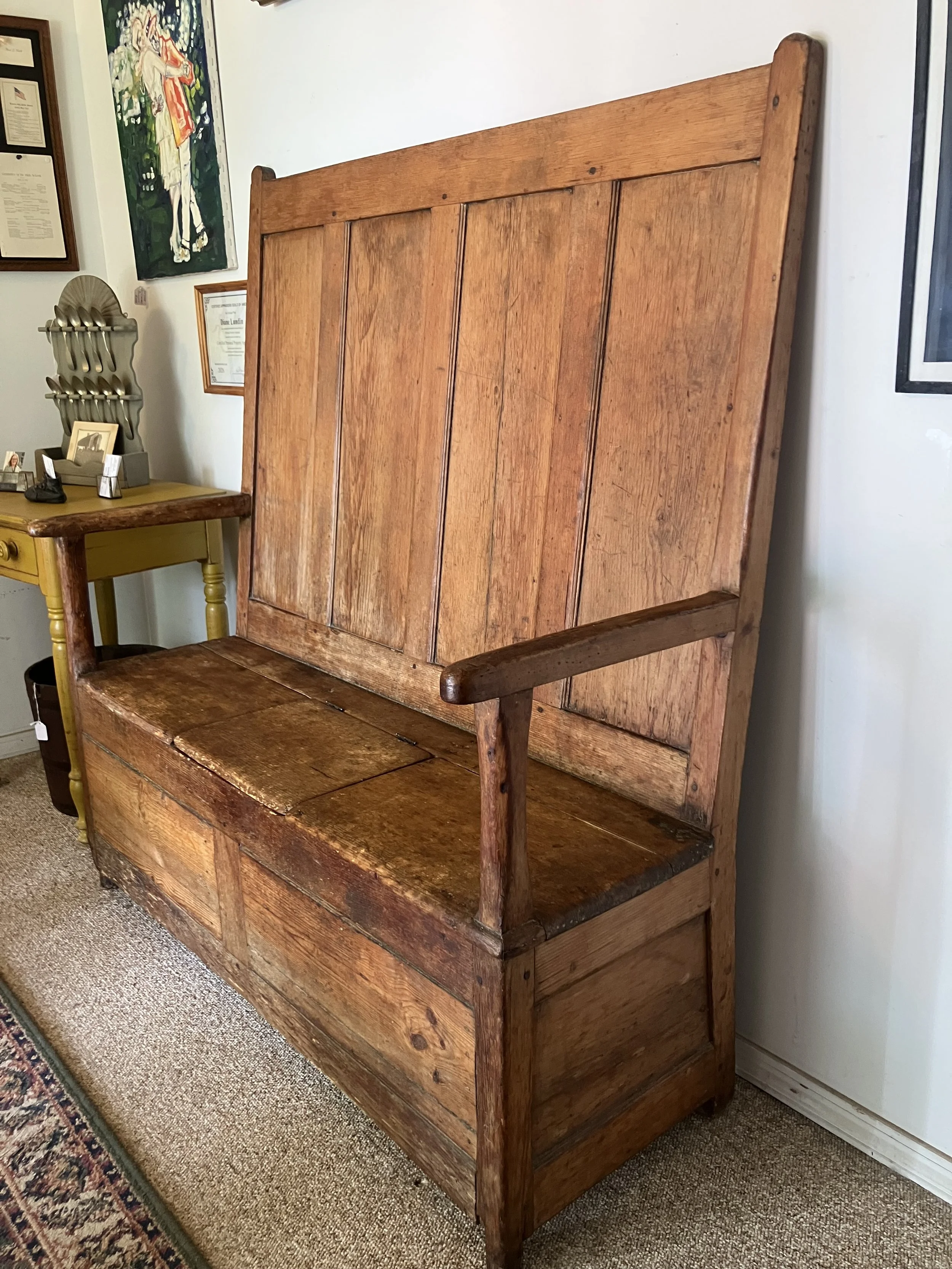  2261035 Early American, Pine Bench with High Back and Arms. Storage under the seat. New England. Late 1700’s. 48” L x 53.5”H x 21” D. $1685 