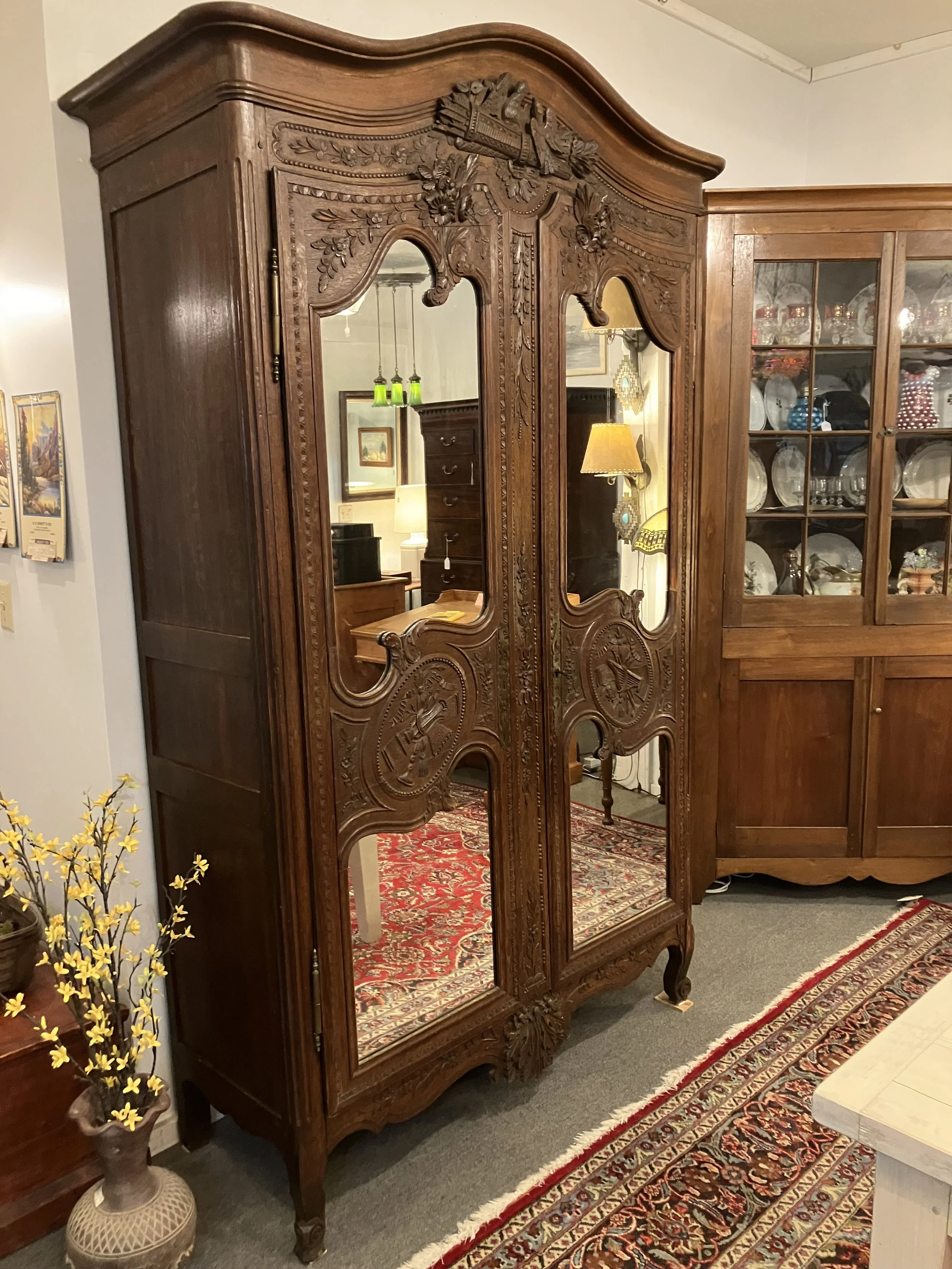  BH-1  Period, Louis XV Armoire originally made in Normandy, France. Made for the groom of a wedding. Hand carved. Mirrored doors. Circa 1750. 56.5” W x 21.5” D x 91.5” H.  