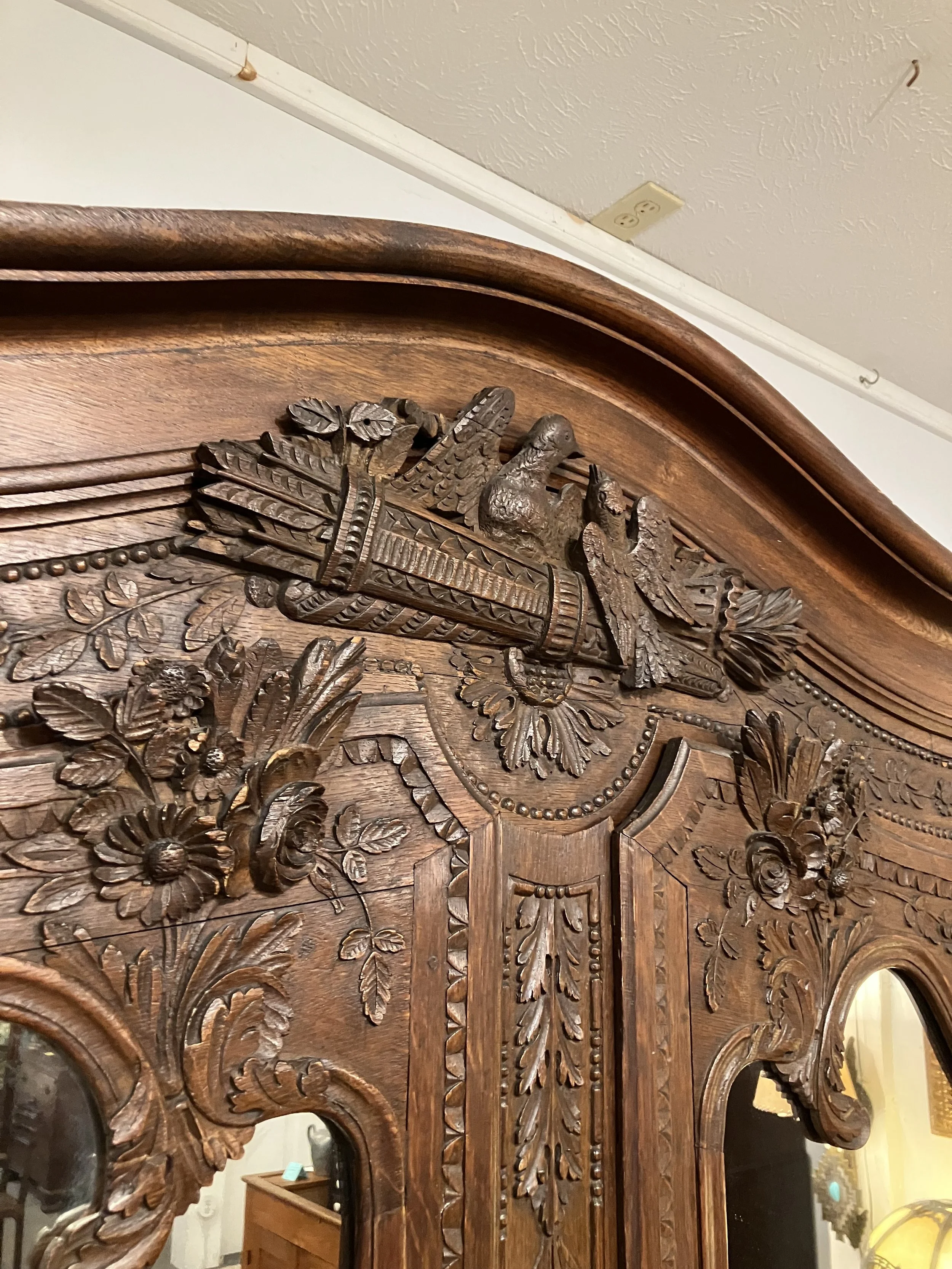  BH-1  Period, Louis XV Armoire originally made in Normandy, France. Made for the groom of a wedding. Hand carved. Mirrored doors. Circa 1750. 56.5” W x 21.5” D x 91.5” H.  