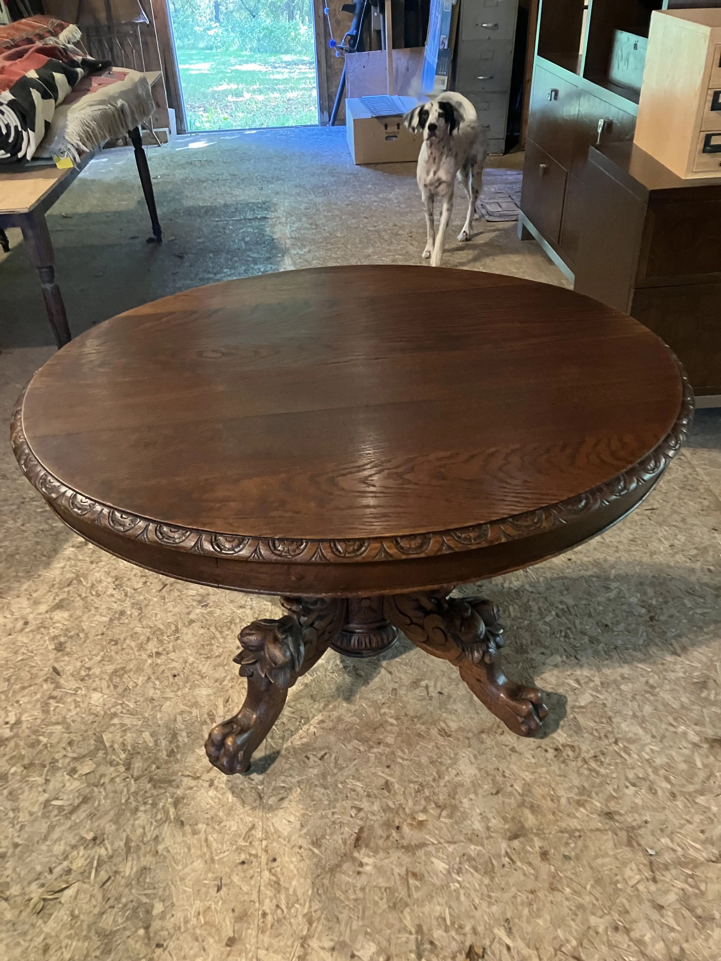  2261033 German, Oak, Table. Center pedestal has hand-carved winged griffins on the legs. Seats 4. Circa 1880. 45” diameter x 28” H. $950 