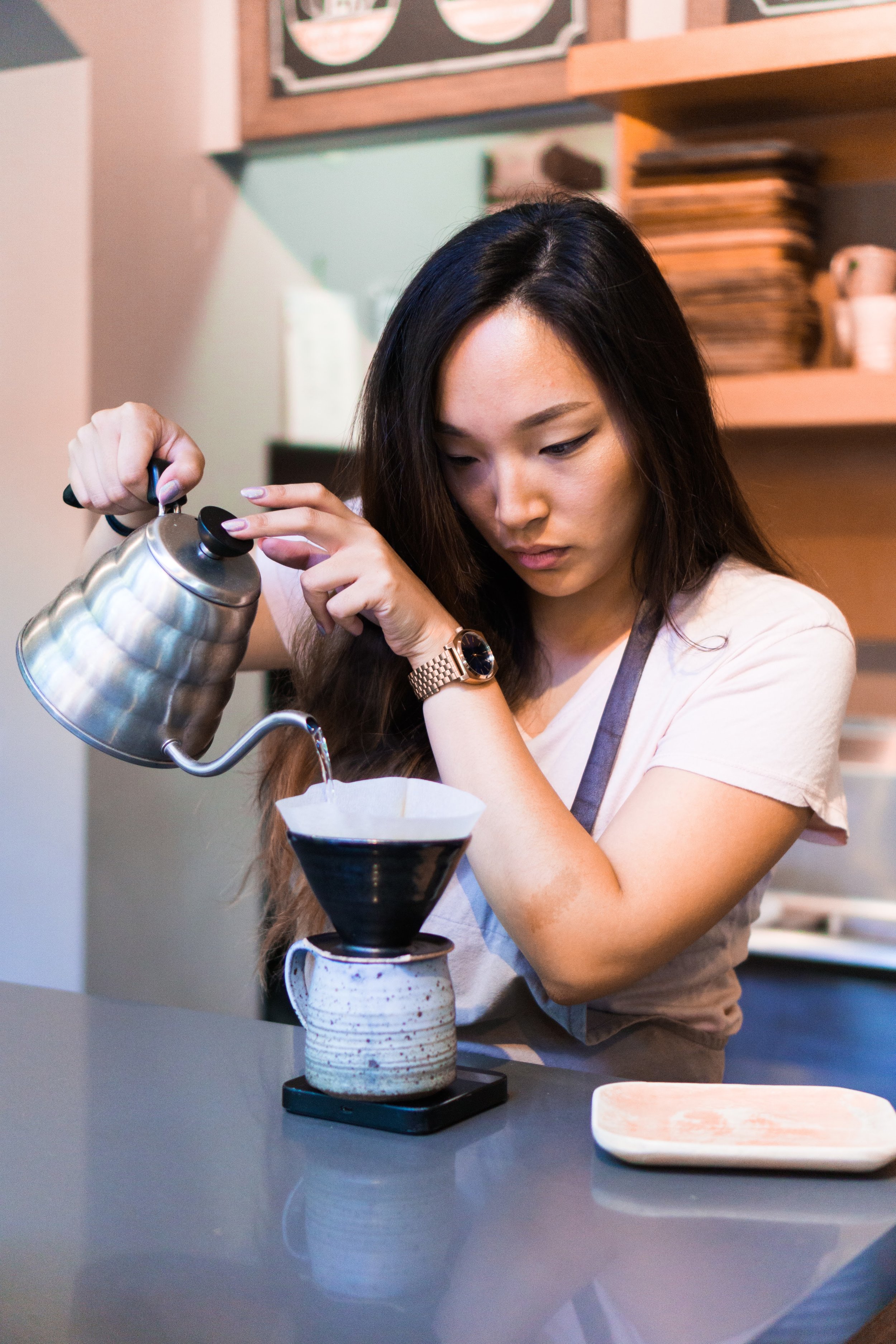 Sue's Gallery and Cafe, my first pour over coffee, Saratoga, California. "I only work here on the weekends. I collect sneakers."