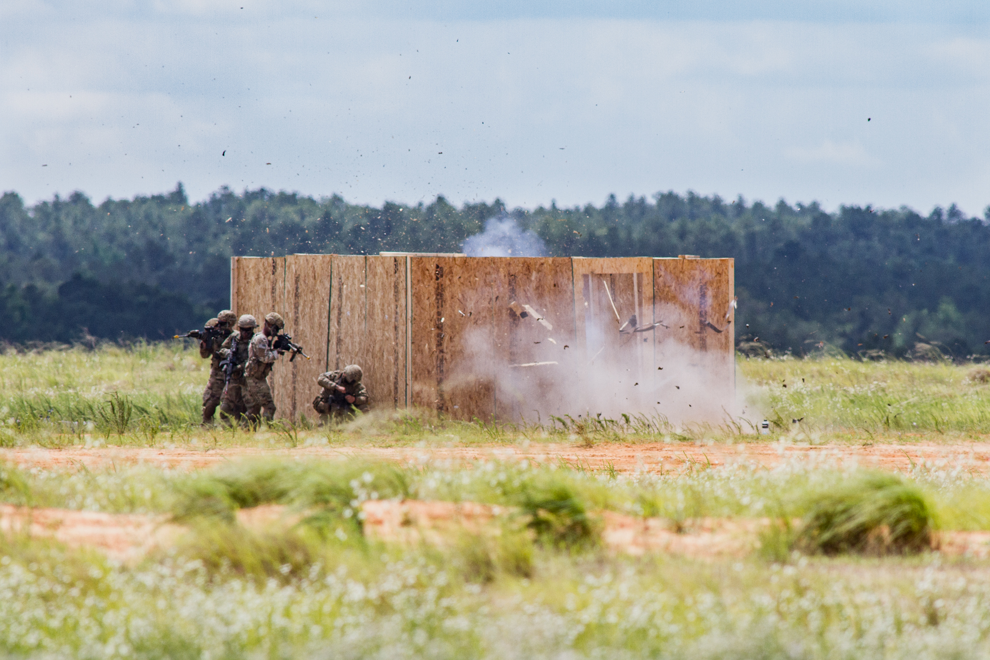  Paratroopers from the 82nd Airborne Division demonstrate a breaching charge on a walled compound as part the Airborne Review at Sicily Drop Zone at Fort Bragg, N.C., on Thursday, May 25, 2017. 