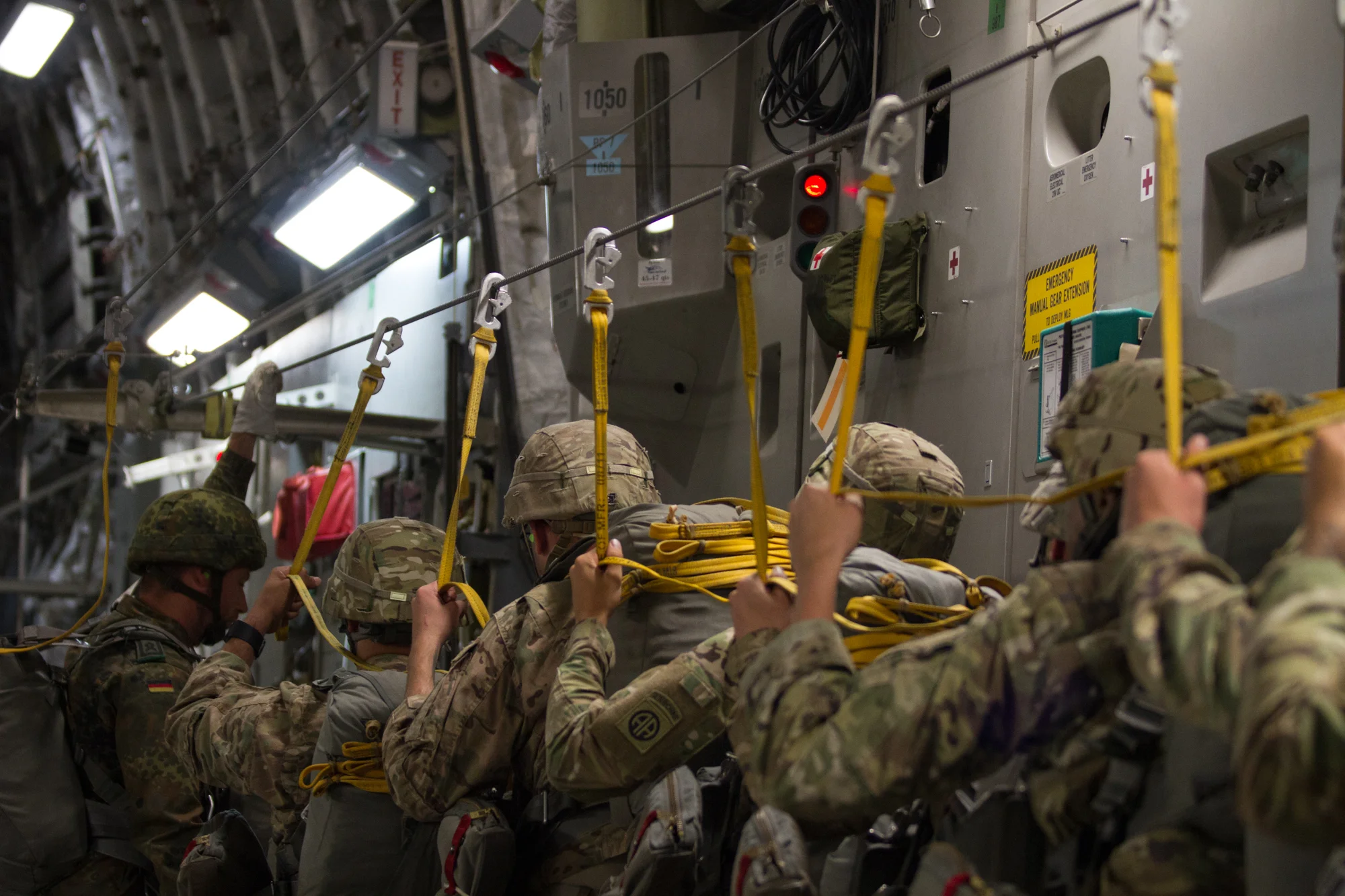 Paratroopers with the 82nd Airborne Division walk towards the jump door during a training jump at Fort Bragg, N.C. on July 26, 2017.