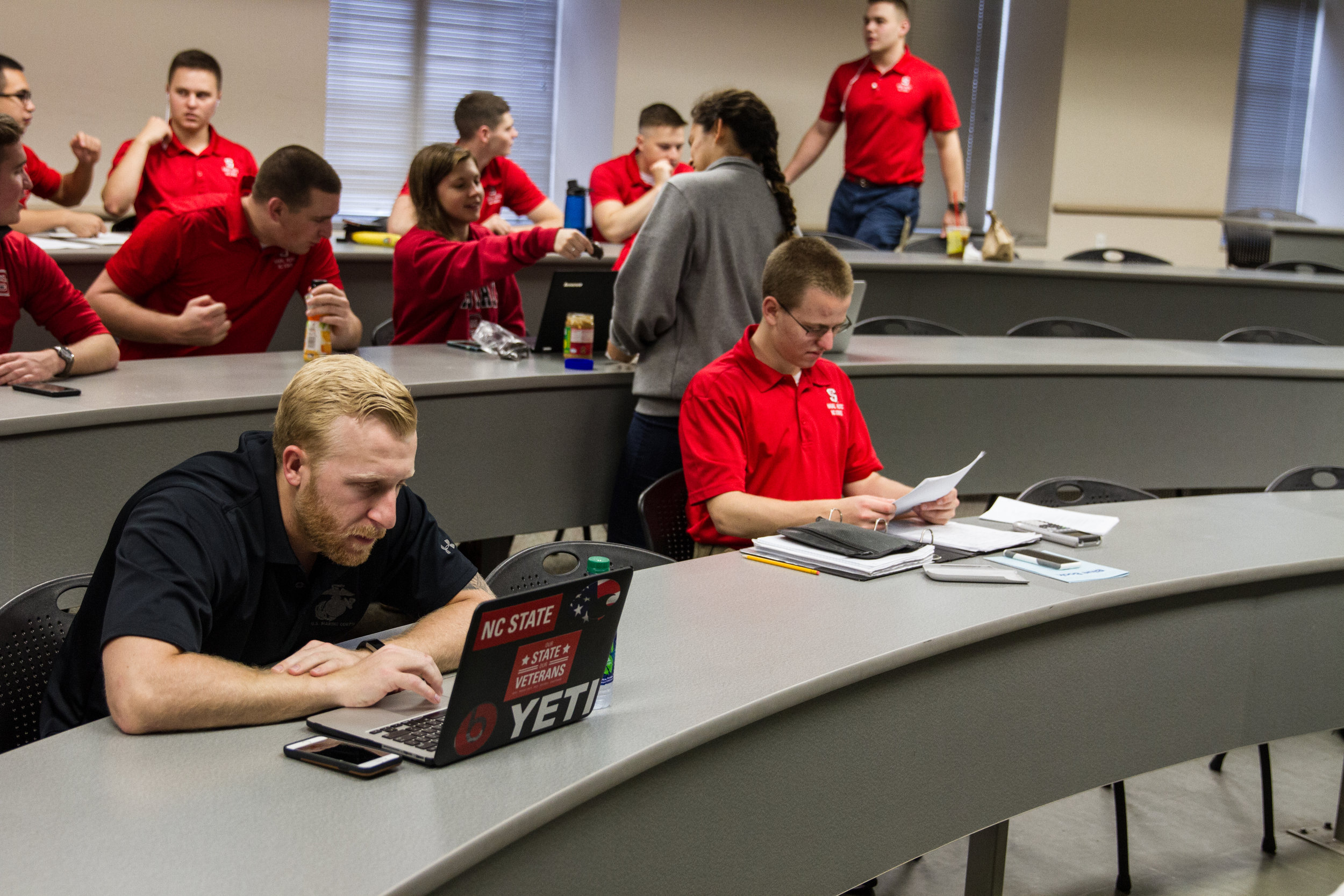 Fontenot reads up on his notes before the start of his class. The majority of the rest of the students in the class are ROTC cadets (the students in red shirts), who will eventually be military officers. “I’m 26 and I’m going to school with people w