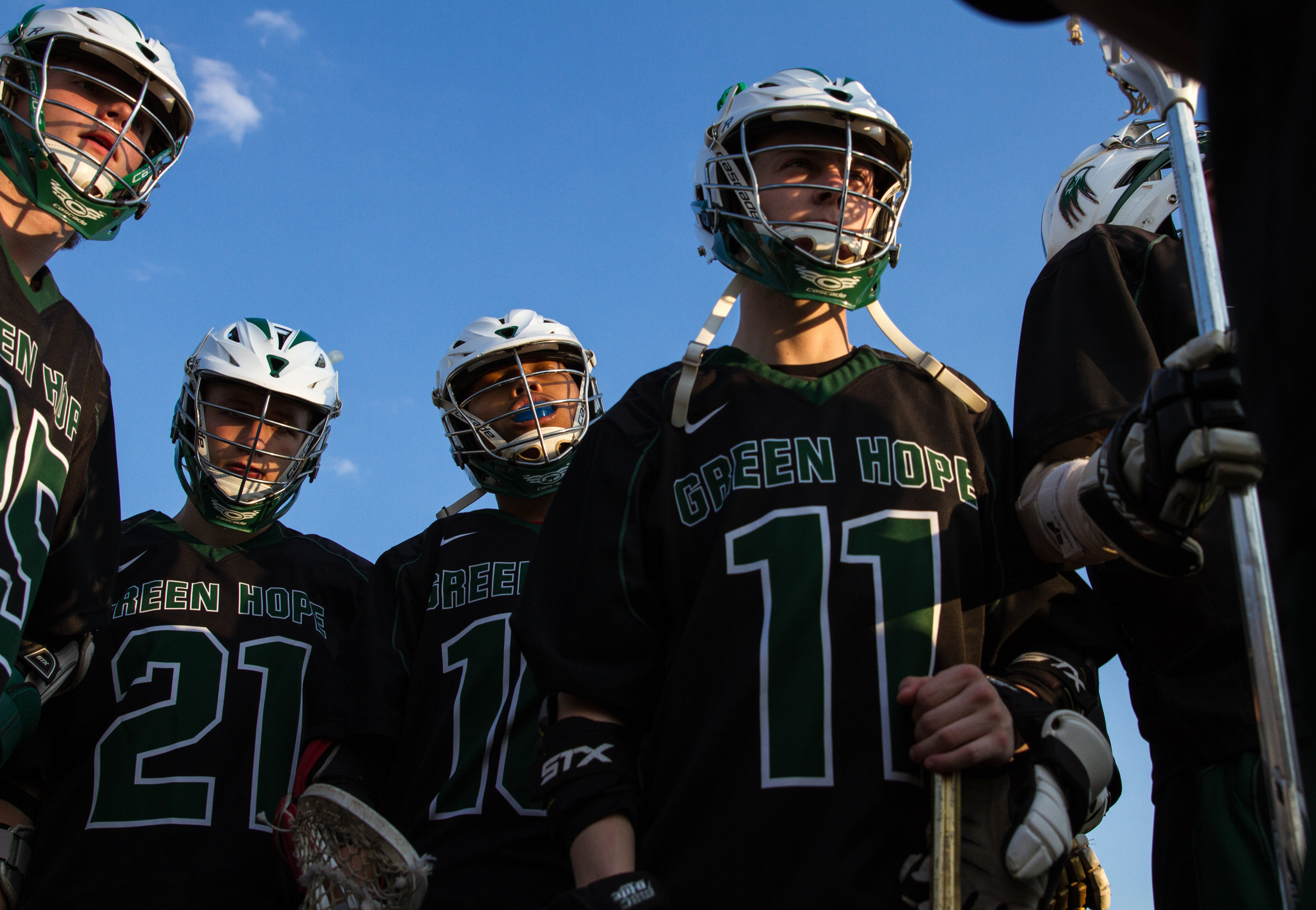  Players Jack Larkin, Jack Stiglitz, Isaias Delgado, and Colin Reyer join the huddle before Green Hope's sixth game, at Middle Creek High School. Green Hope would go on to lose the game 19 to 5. March 21, 2017.&nbsp; 