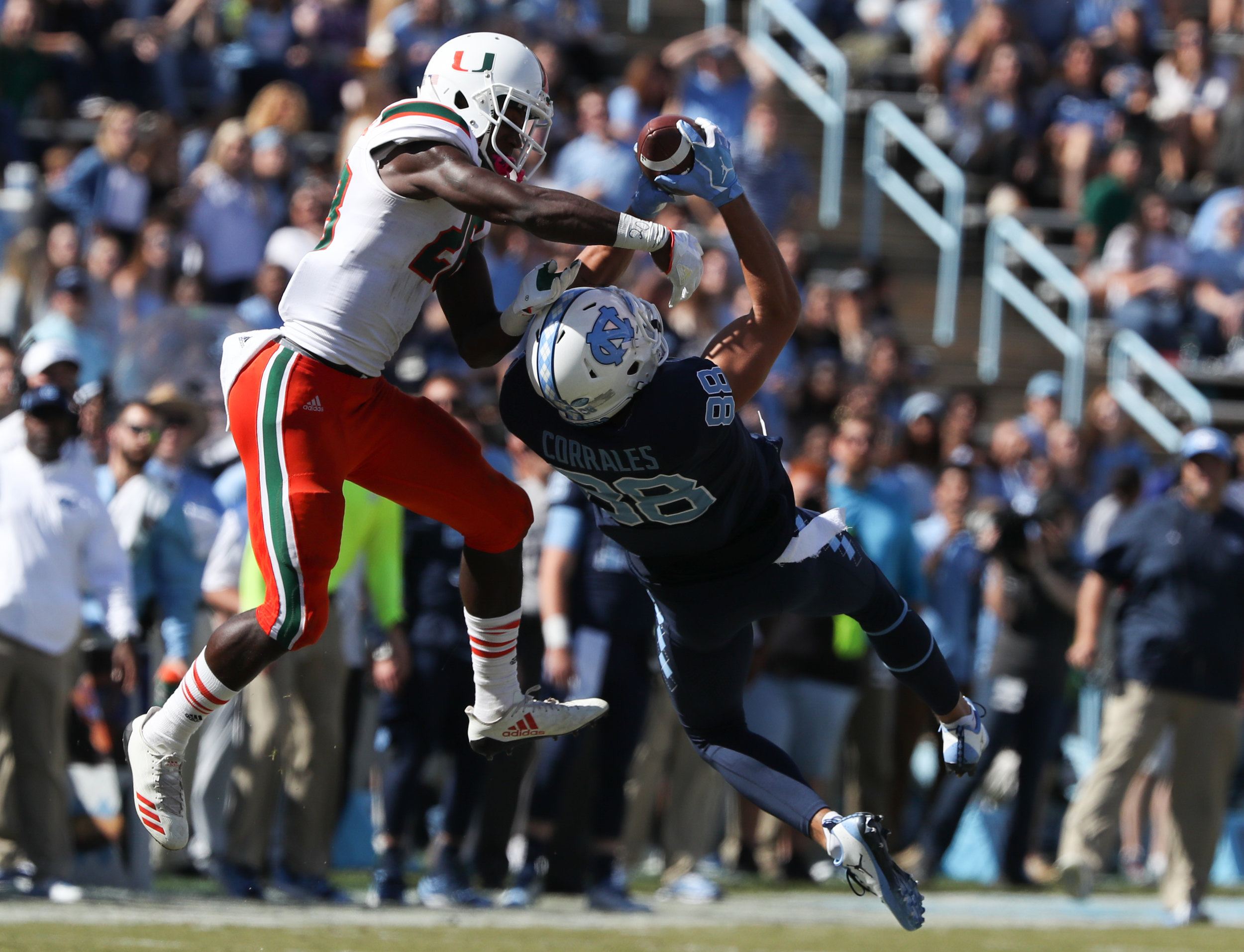  UNC’s Beau Corrales, right, grabs a pass in front of Miami’s Michael Jackson during Saturday’s game at Kenan Memorial Stadium in Chapel Hill, NC on October 28, 2017. The Hurricanes beat the Tar Heels 24 to 19. 
