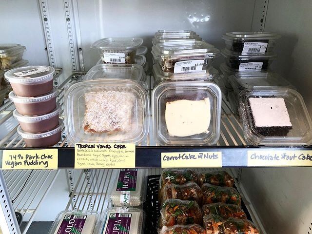 Our lineup of sweet treats, vegan 74% dark chocolate tofu pudding, tropical vanilla cake, carrot cake with cream cheese frosting, and chocolate stout cake. Find them in our fridge. Get it while it lasts!