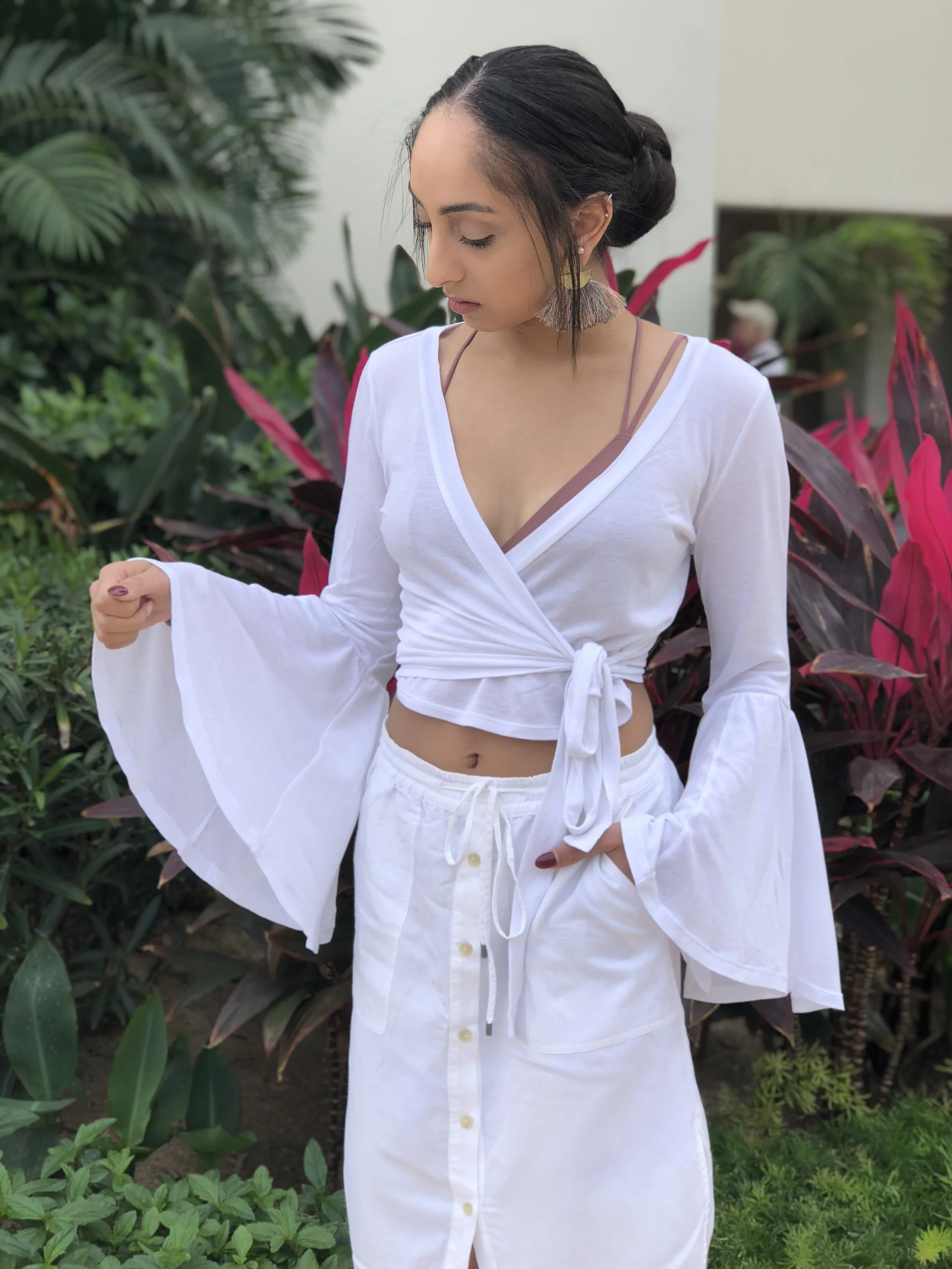 What's a vacation without an all-white outfit? Here I paired this white midi skirt from Nordstrom Rack with this billow sleeve wrap top from Urban Outfitters. For accessories I added this bralette from Nordstrom Rack with these fringe earrings from TjMaxx.