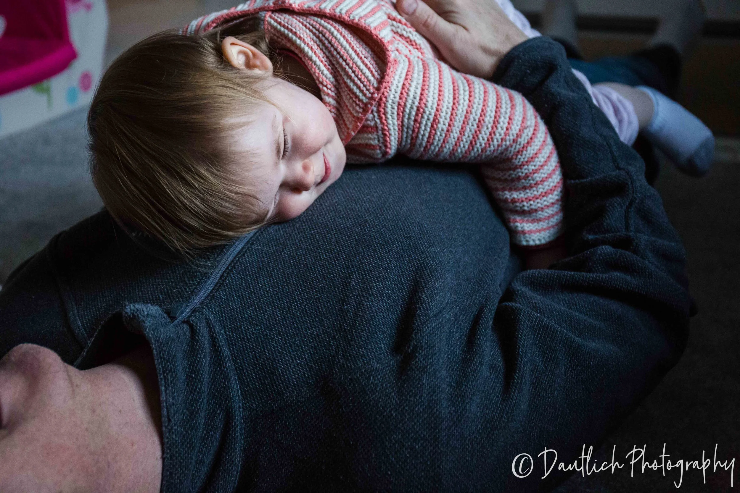 Hazel cuddles with dada. An infrequent activity.