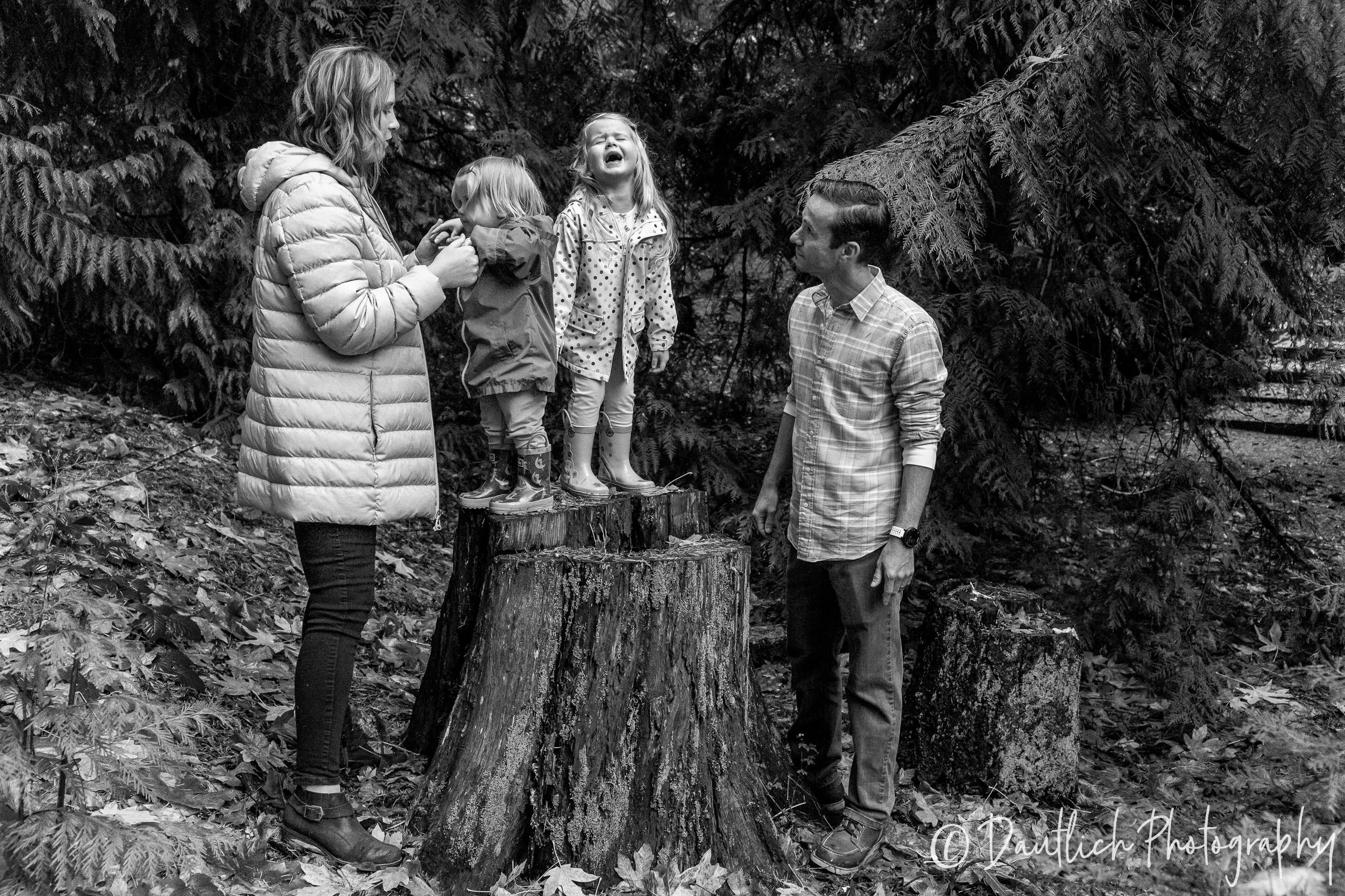 The Ringer family stops at a log during our walk in the woods behind their new home. Delaney has a little tantrum for just a moment while dad stares as her.
