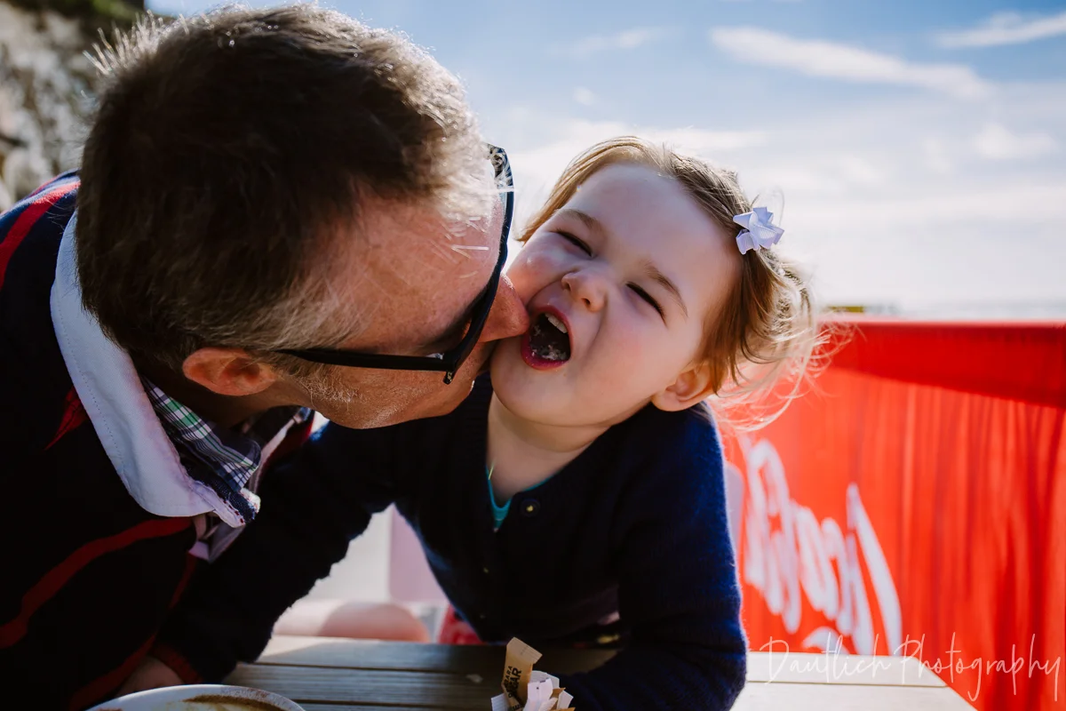 Hazel and Nick snacking at Molly's Cafe at Rottingdean Beach.