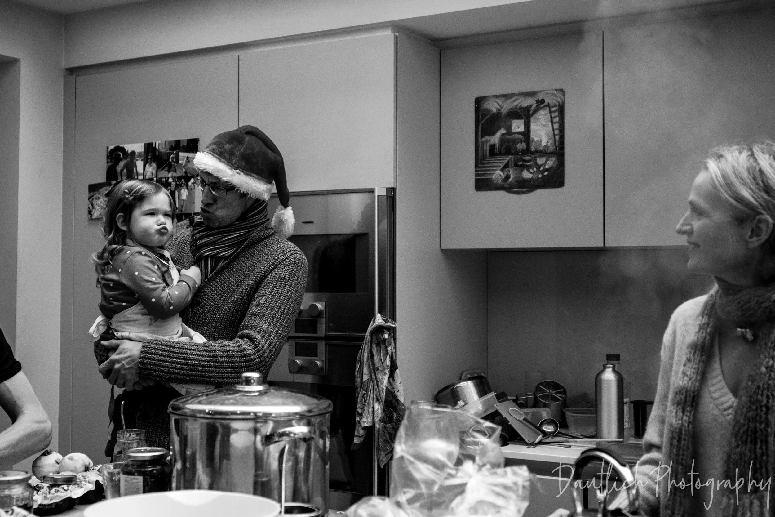 Uncle Marc making silly faces with Hazel as they cook Christmas dinner together in West Dulwich, London.
