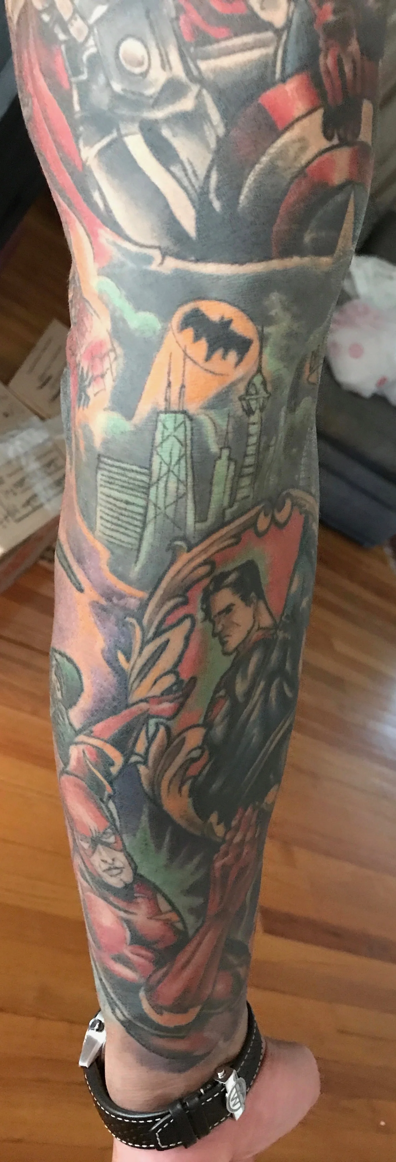 The upper part of the sleeve is an amazing cover up by Quori who transformed a botched tatoo into an amazing Avengers tattoo. A couple of years later I decided that it would be cool if I did the lower part of it entirely in DC heroes.