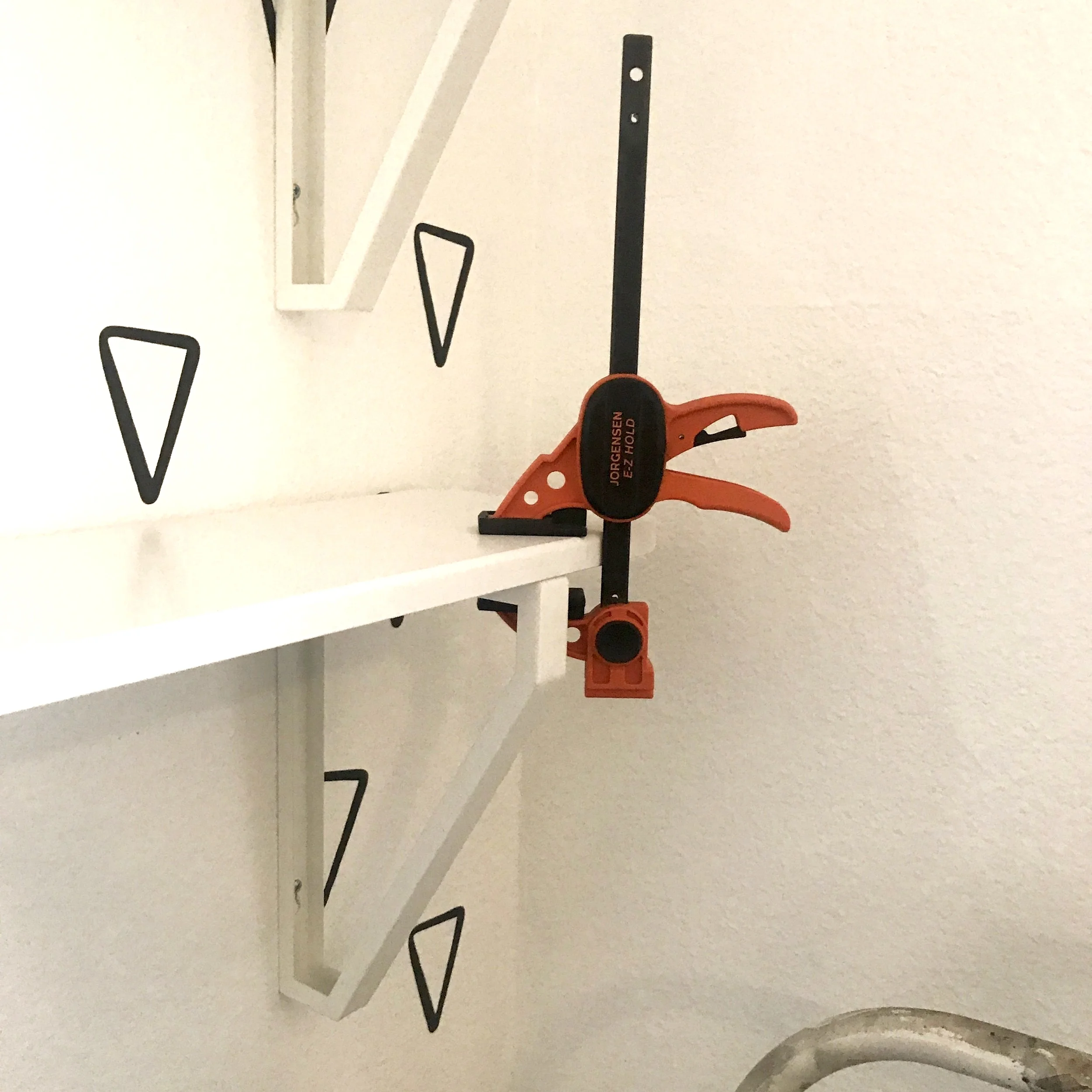 Using a clamp to hold them down while screwing them in. These Pony | Jorgensen clamps ROCK!!!