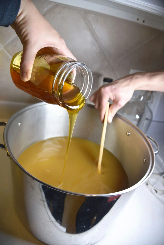 Adding Local Honey to Fire Cider Pot