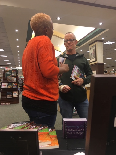 talking with male customer - book signing.JPG