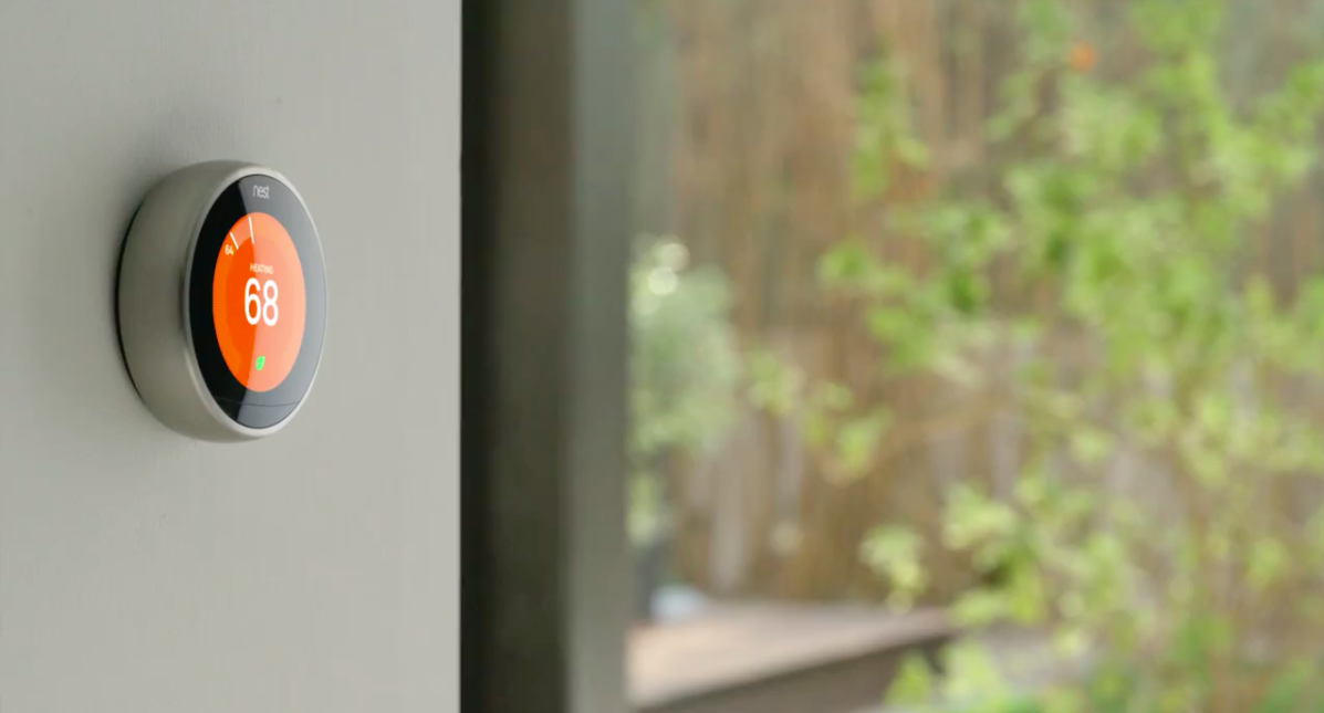 Nest Thermostat on wall Smart Phone Control