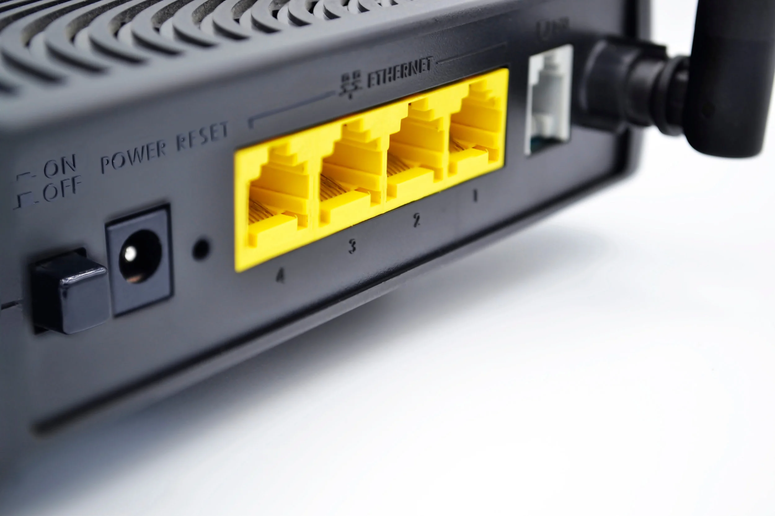 Wireless router black box yellow RJ45 ethernet ports Home Networking